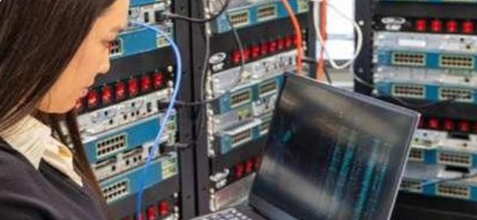 Engineer working at a network rack